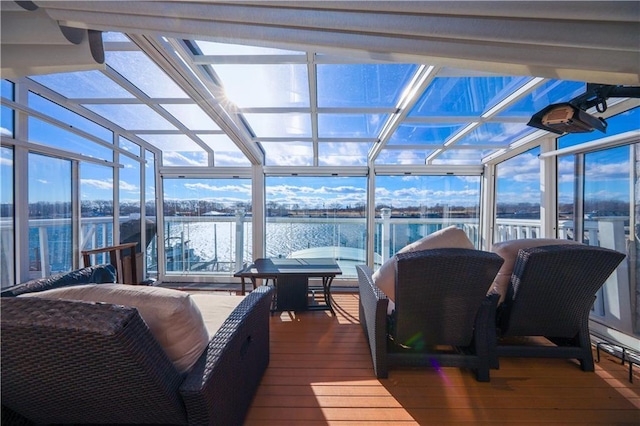 sunroom / solarium with a water view