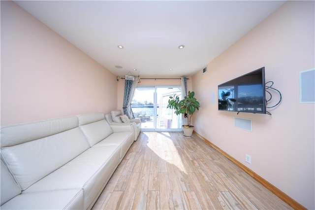 unfurnished living room featuring light hardwood / wood-style flooring