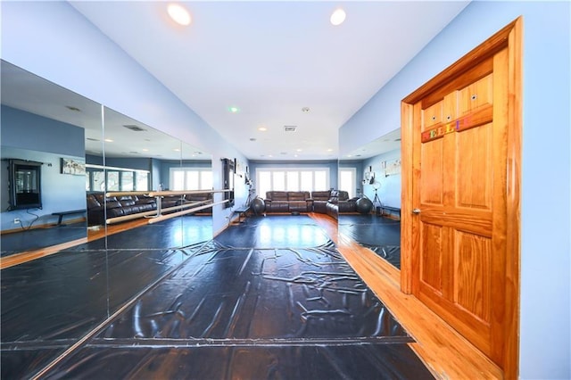 gym with hardwood / wood-style flooring