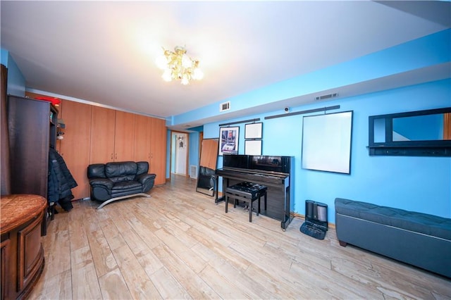 interior space with light hardwood / wood-style flooring and a notable chandelier