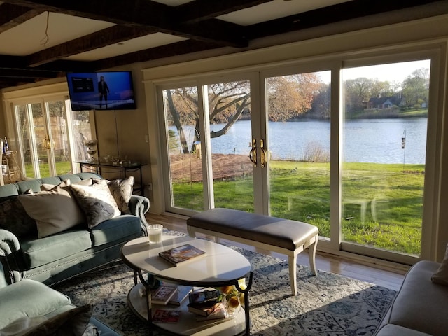 888 Pondview Rd, Riverhead, NY 11901 - sunroom with a water view, plenty of natural light, and beam ceiling
