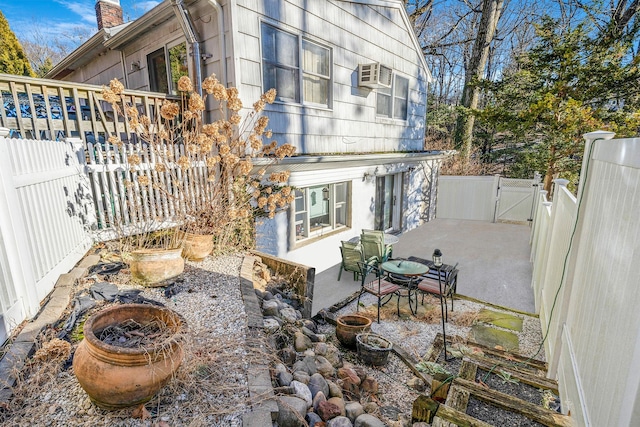 view of patio with a wall mounted AC