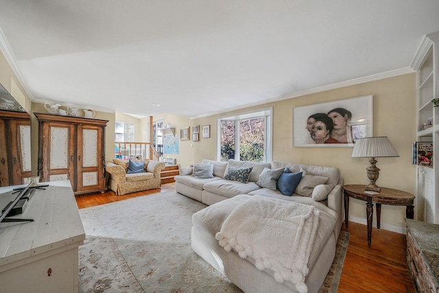 living room featuring hardwood / wood-style floors and crown molding