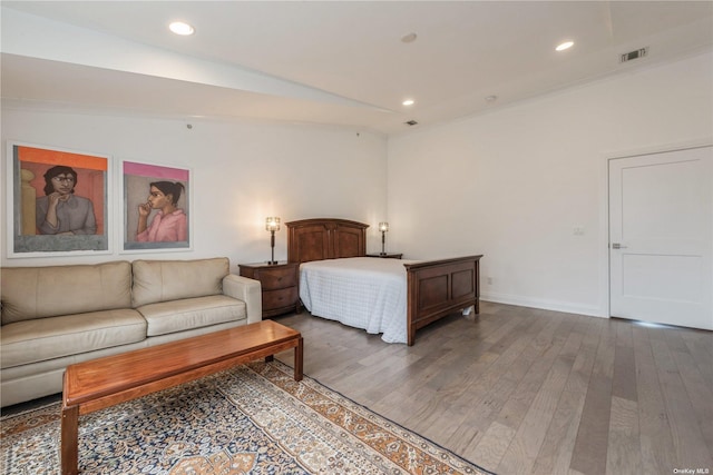 bedroom featuring dark hardwood / wood-style flooring