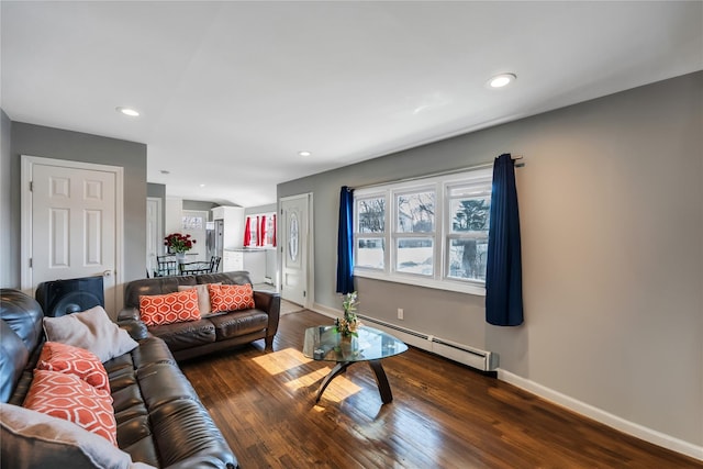 living room featuring a baseboard radiator, baseboards, dark wood-style flooring, and recessed lighting