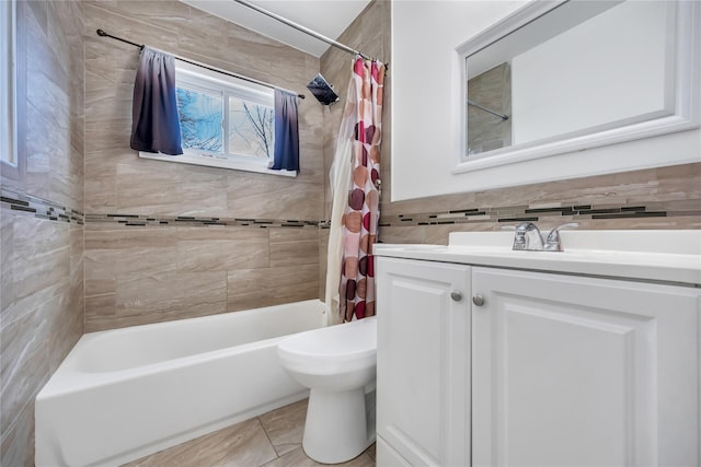 full bath featuring toilet, vanity, tile walls, and shower / bathtub combination with curtain