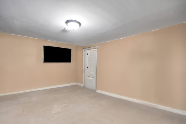 unfurnished room featuring baseboards