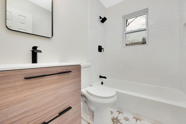 full bathroom with vanity, tiled shower / bath combo, and toilet