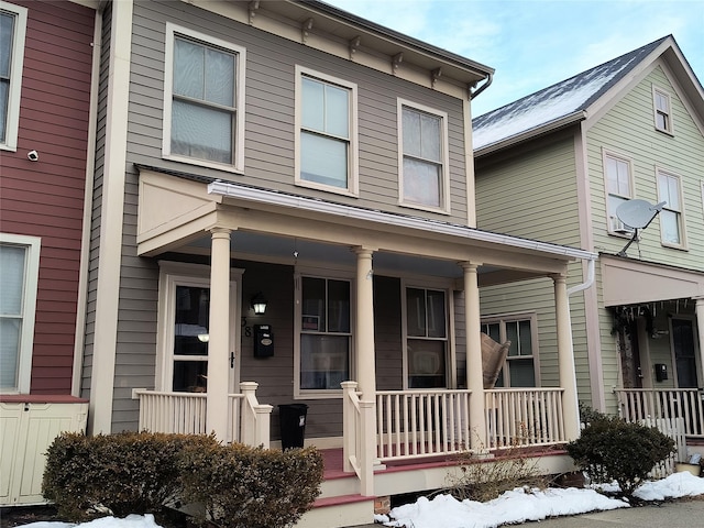 view of property with covered porch