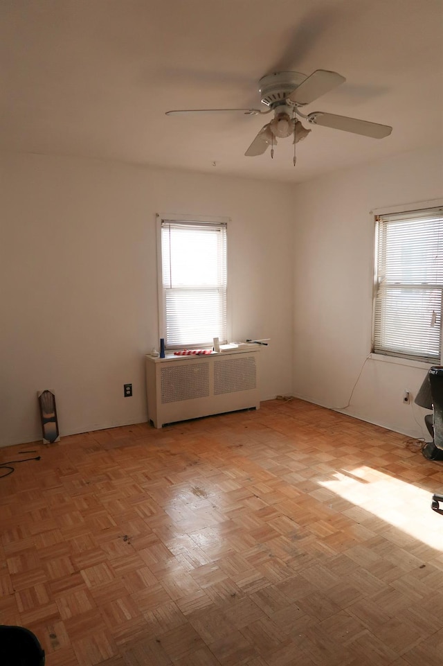 11551 209th St, Cambria Heights, NY 11411 - spare room featuring radiator heating unit and a ceiling fan