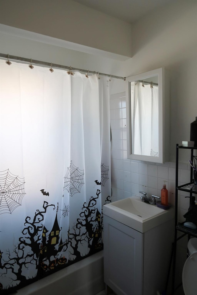 11551 209th St, Cambria Heights, NY 11411 - full bath with shower / bath combo, tile walls, backsplash, and vanity