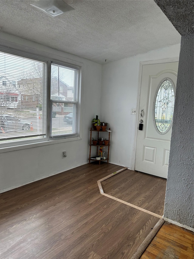 11551 209th St, Cambria Heights, NY 11411 - foyer with a textured ceiling and wood finished floors