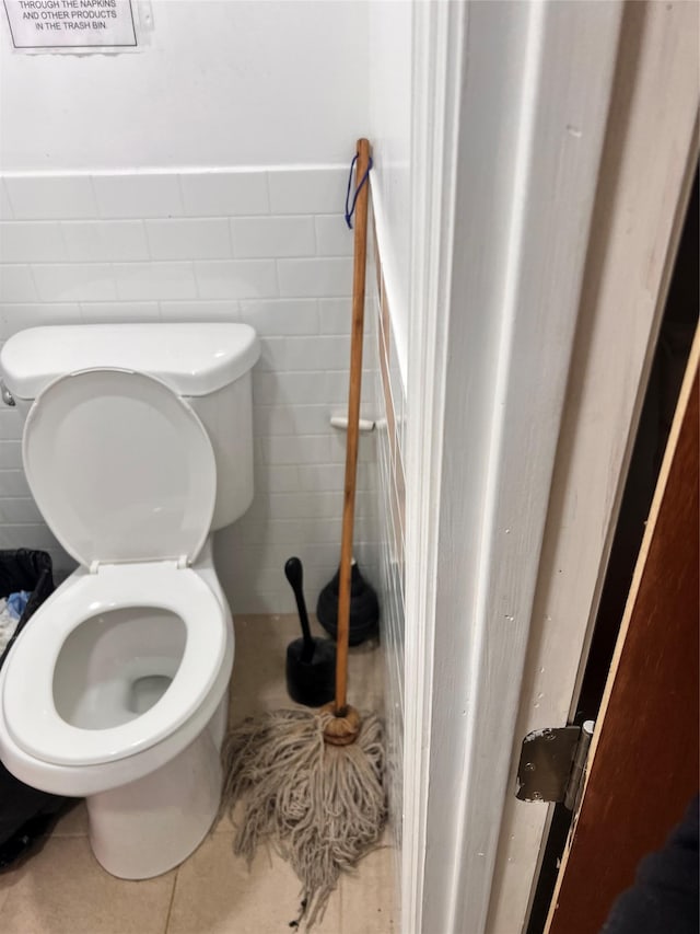 200-21 Hollis Ave, Saint Albans, NY 11412 - bathroom featuring tile walls, tile patterned floors, and toilet
