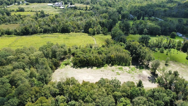 bird's eye view featuring a wooded view