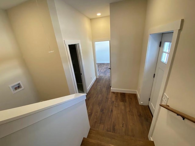 hallway with dark wood-type flooring