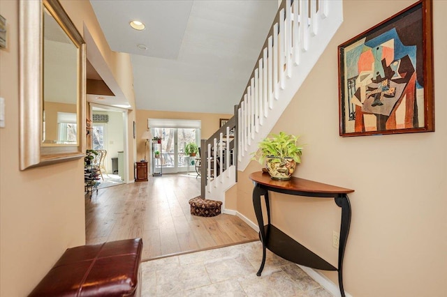 entryway featuring stairs, recessed lighting, wood finished floors, and baseboards