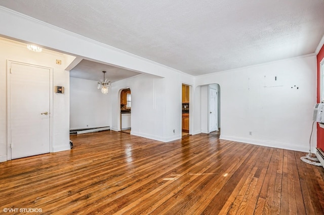 unfurnished living room featuring a baseboard radiator, a textured ceiling, crown molding, hardwood / wood-style floors, and an inviting chandelier