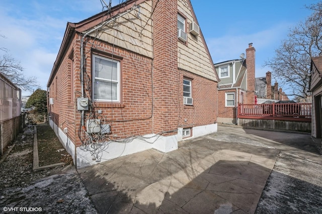 view of property exterior featuring a patio area