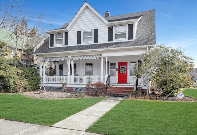 view of front facade featuring a porch and a front yard