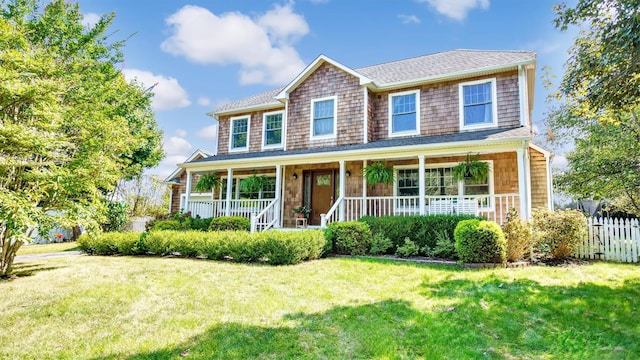 view of front facade with a front lawn and a porch