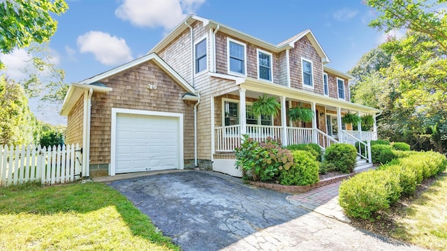 view of front of home with a garage and covered porch