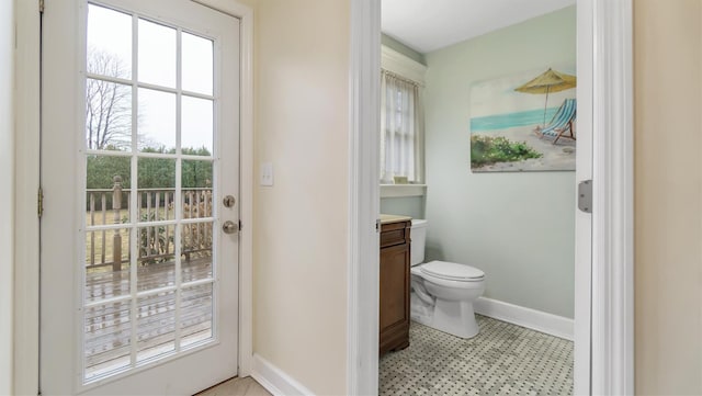 bathroom featuring vanity and toilet