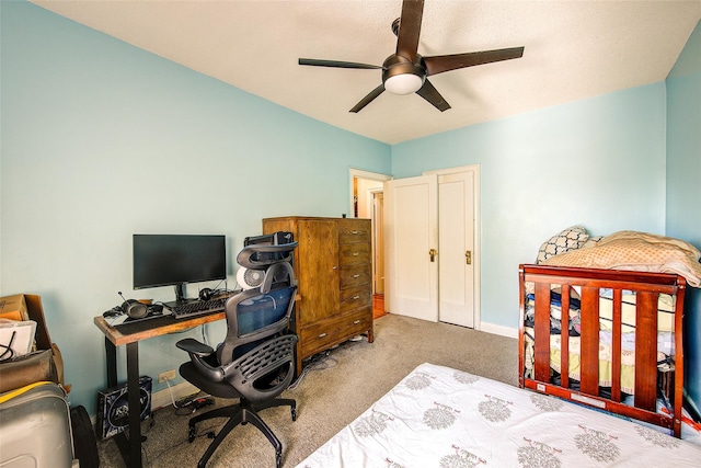 carpeted bedroom with ceiling fan