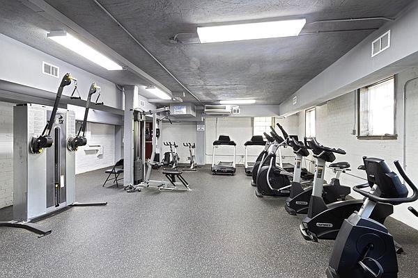 workout area with a healthy amount of sunlight and a textured ceiling