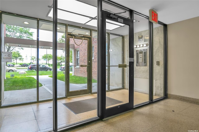 doorway to outside with expansive windows