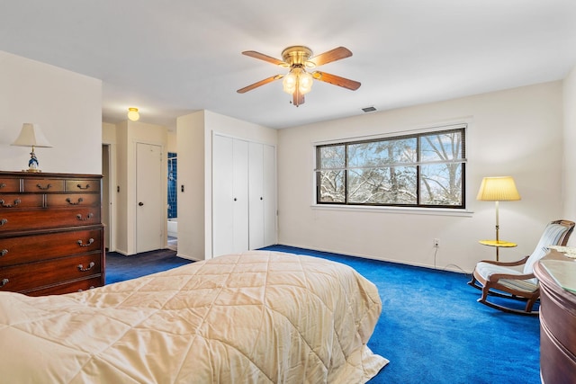 bedroom featuring dark colored carpet and ceiling fan