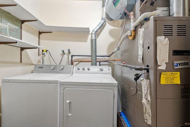 washroom featuring washer and clothes dryer