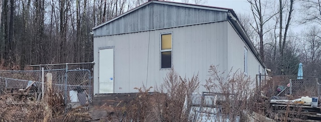 view of outbuilding with fence