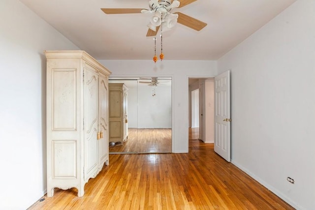 spare room with ceiling fan and light hardwood / wood-style floors