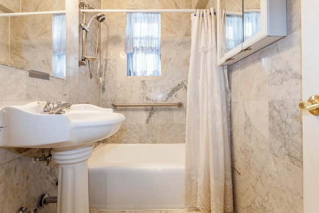 bathroom with shower / bath combo with shower curtain