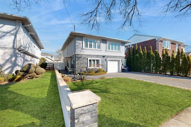 view of front of property with a garage, stone siding, driveway, stucco siding, and a front lawn