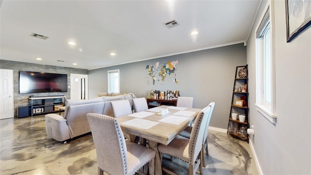 dining area featuring finished concrete floors, recessed lighting, visible vents, and baseboards