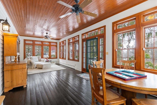 sunroom with wooden ceiling, baseboard heating, and a ceiling fan