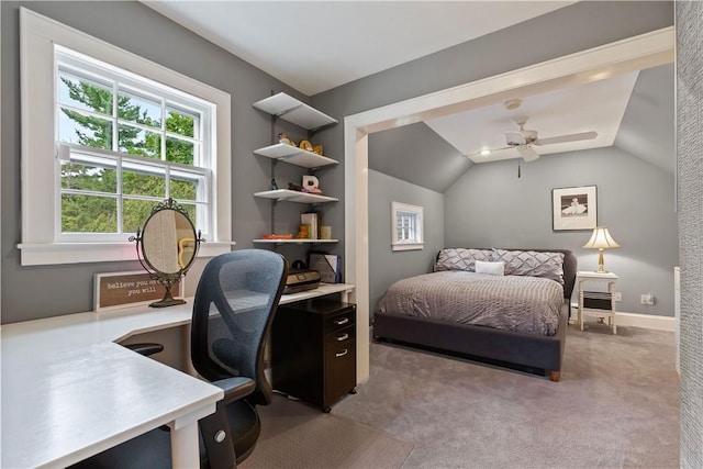 carpeted bedroom featuring baseboards and vaulted ceiling