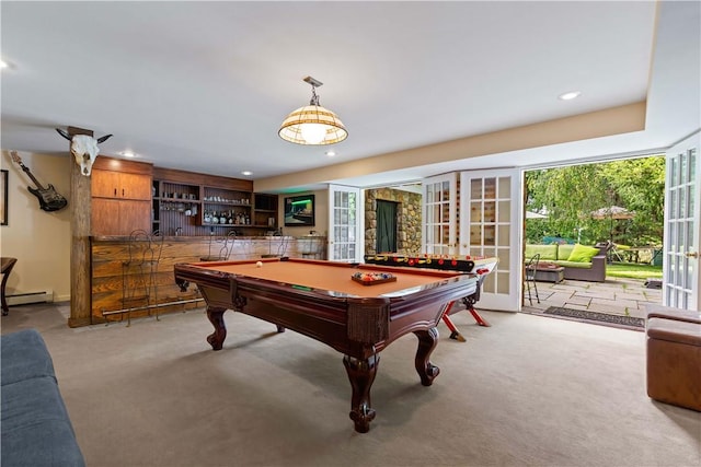 rec room with a baseboard radiator, recessed lighting, carpet floors, indoor bar, and french doors