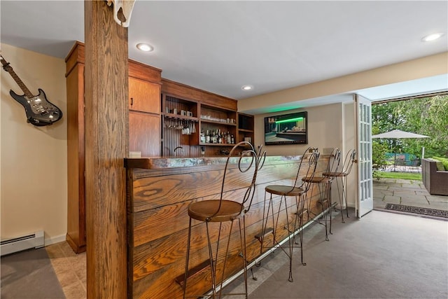 bar featuring a baseboard heating unit, recessed lighting, baseboards, and wet bar