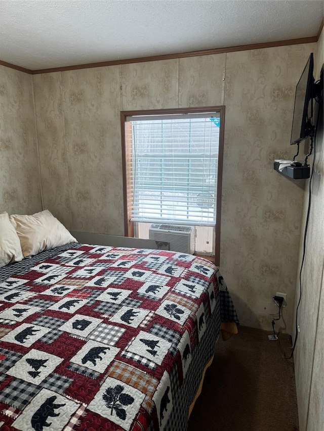 bedroom featuring a textured ceiling, carpet floors, and cooling unit