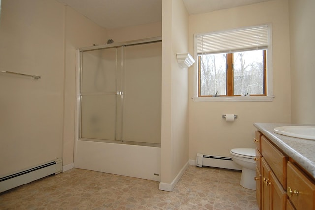 full bathroom with a baseboard radiator, vanity, shower / bath combination with glass door, and toilet