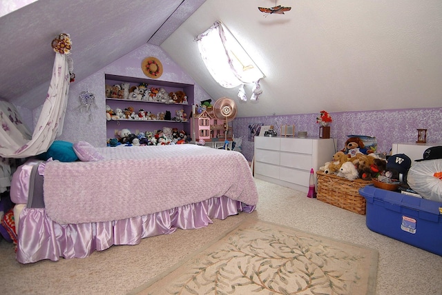 bedroom featuring lofted ceiling, carpet floors, and a textured ceiling