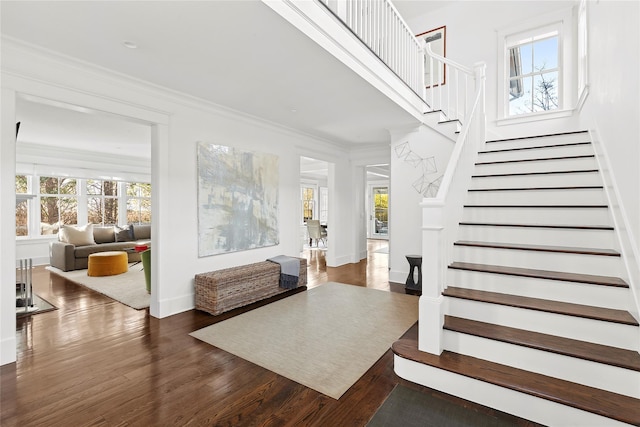 158 Norris Ln, Bridgehampton, NY 11932 - entrance foyer featuring a wealth of natural light, ornamental molding, and dark hardwood / wood-style floors