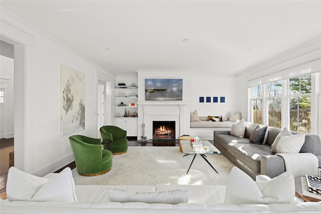 158 Norris Ln, Bridgehampton, NY 11932 - living room featuring ornamental molding, hardwood / wood-style floors, and built in shelves