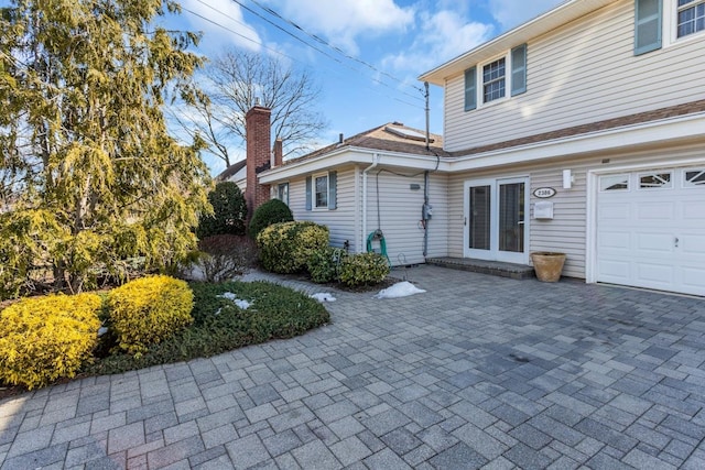 exterior space with a garage