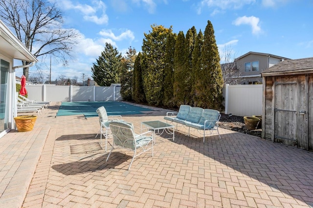 view of patio / terrace with a storage unit