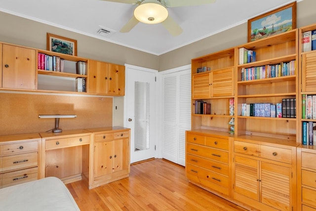 interior space with light hardwood / wood-style flooring and crown molding