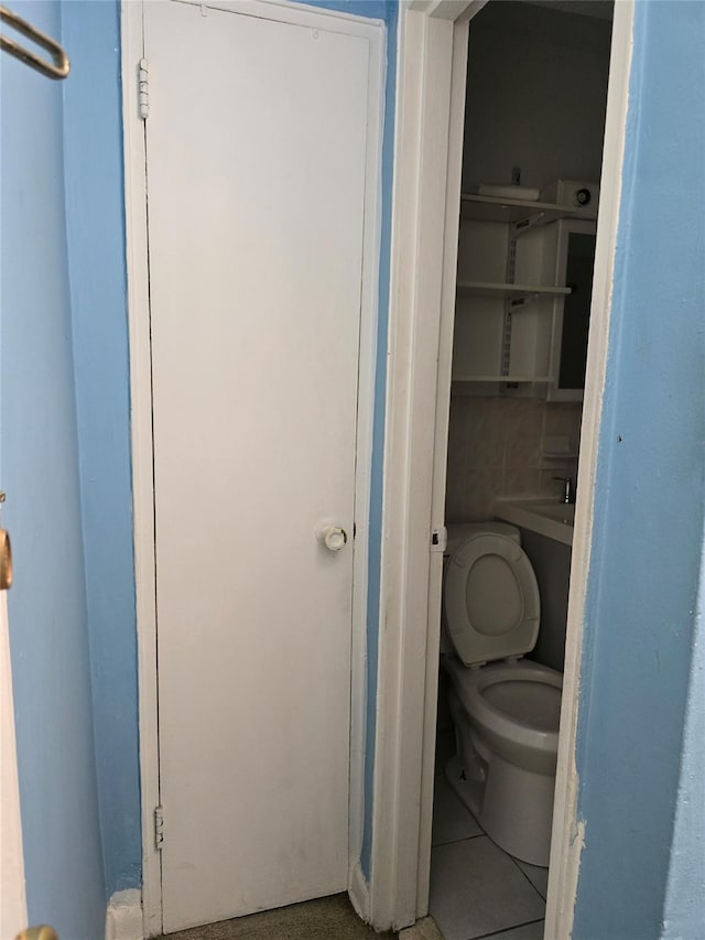87-70 173rd St Unit 4N, Jamaica, NY 11432 - bathroom with toilet and tile patterned flooring