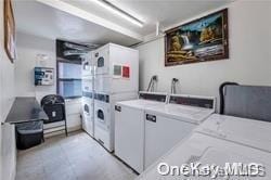 87-70 173rd St Unit 4N, Jamaica, NY 11432 - shared laundry area featuring stacked washer / dryer and washer and clothes dryer